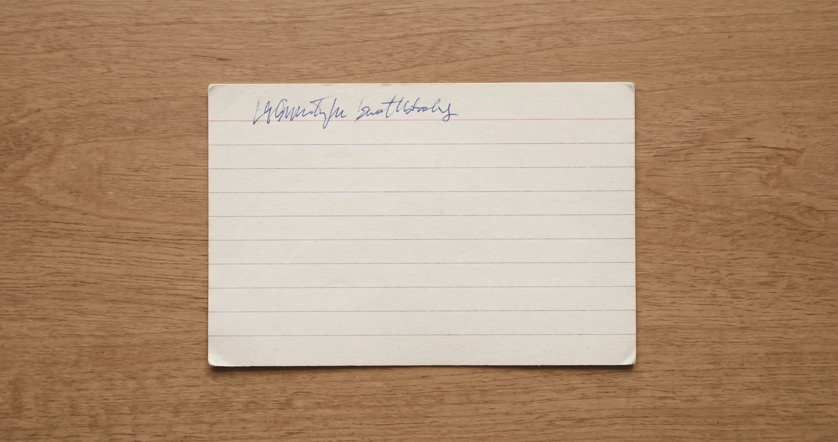 A short handwritten line on an otherwise blank index card.