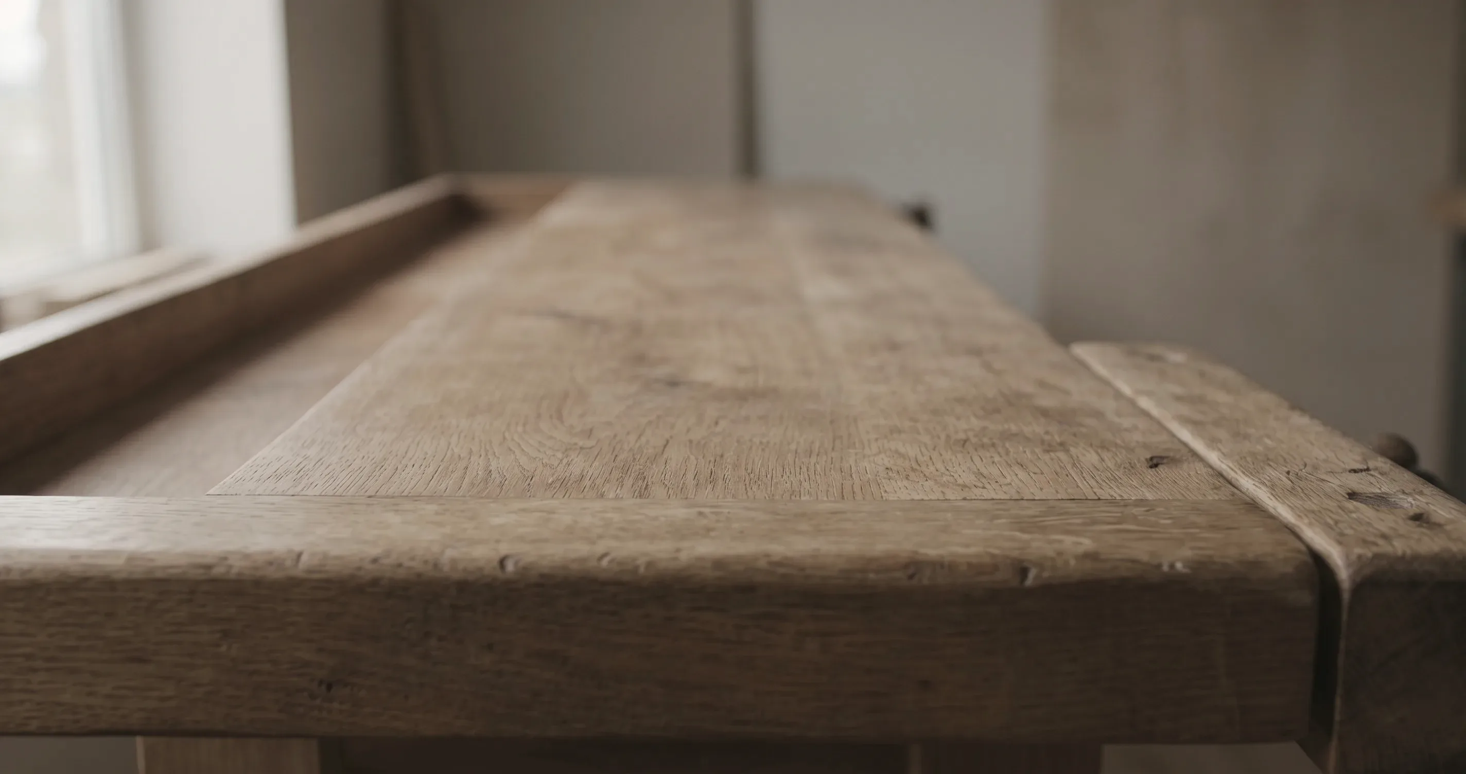 A cleared workbench with tools put away and nothing left on it.