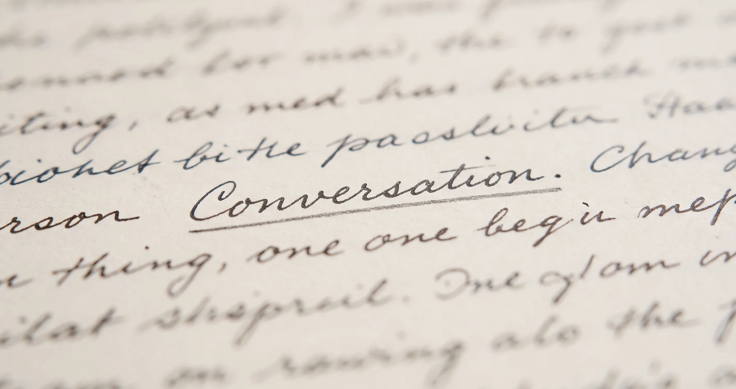 A page of handwriting with the word Conversation underlined, the rest out of focus.
